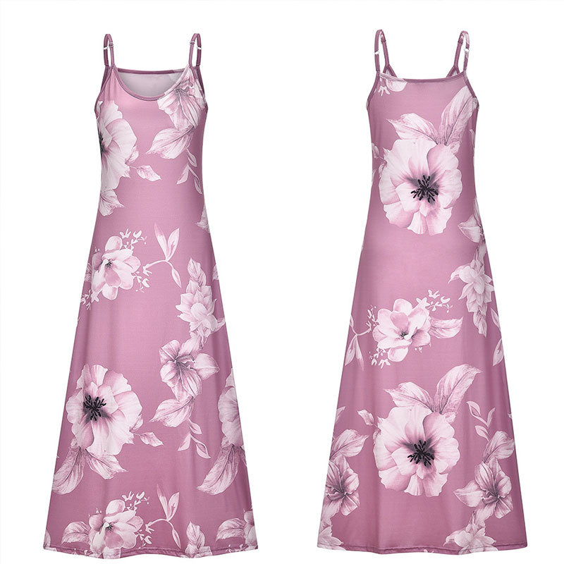 "Boho maxiklänning med färgglatt blommigt tryck, V-ringad, ärmlös, perfekt för sommar. Ger en elegant och avslappnad stil."