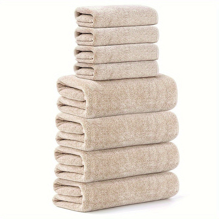 Staplade beige handdukar i olika storlekar