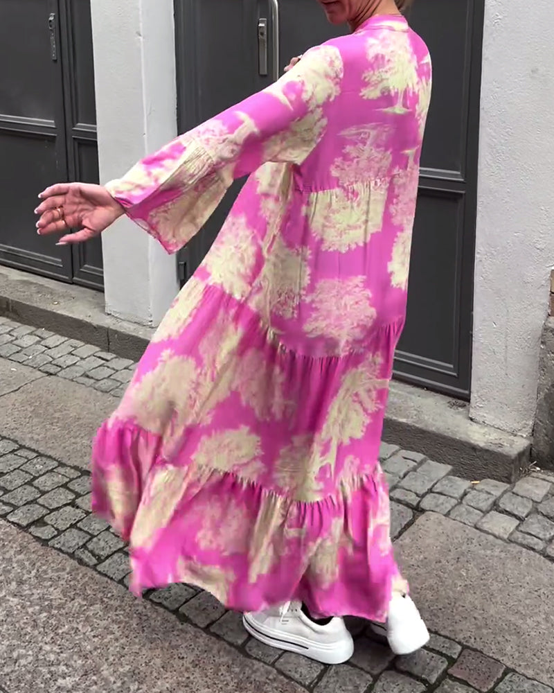 Losgående maxiklänning med V-ringning och trumpetärm