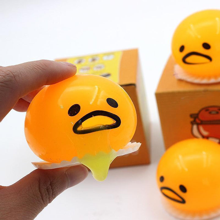 "Charmig äggula tryckboll i gul PVC för stresslindring, klämbar och kompakt för skratt och avkoppling."