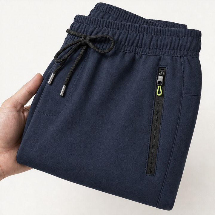 Snygg kombination av grå joggers dam med vardagstopp och skor