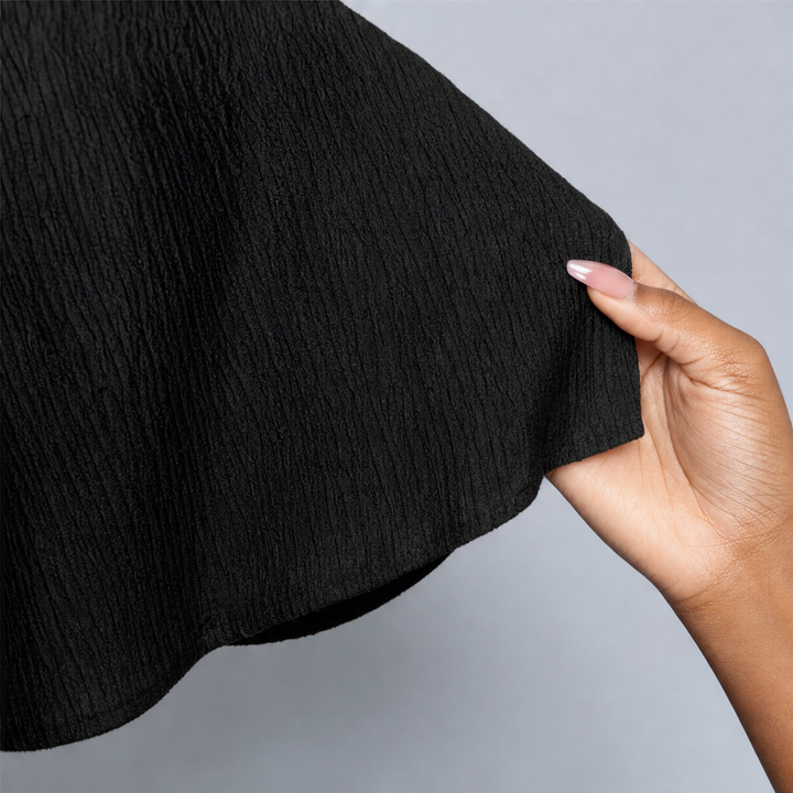 Pliserat damset med topp och byxor i elegant design