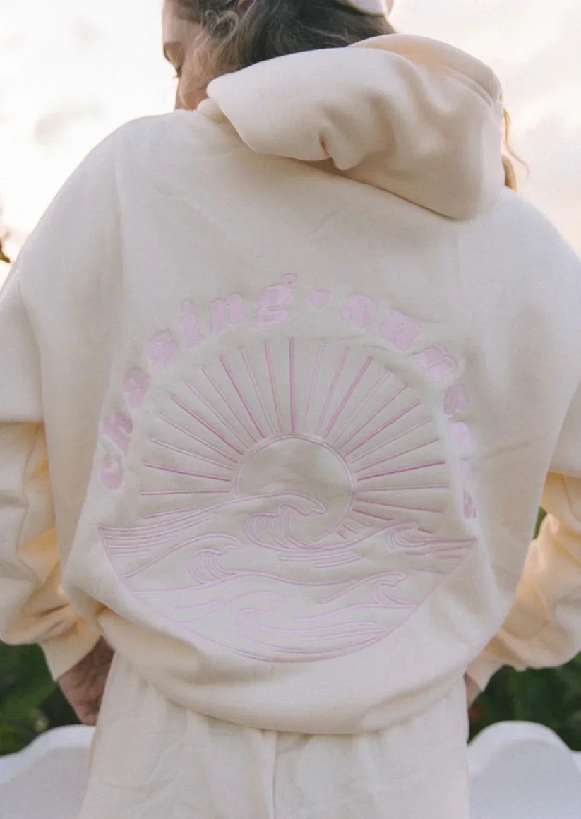 Rosa dam hoodie med tropisk grafik och dragsko i huvan