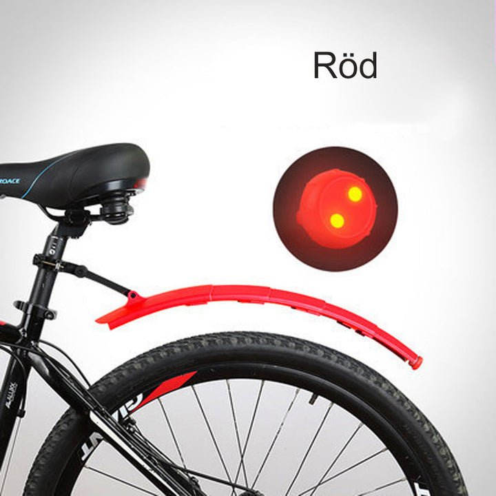 "Cykel stänkskydd, justerbart och vattentätt, med inbyggt bakljus, i svart plast för optimal säkerhet och synlighet."