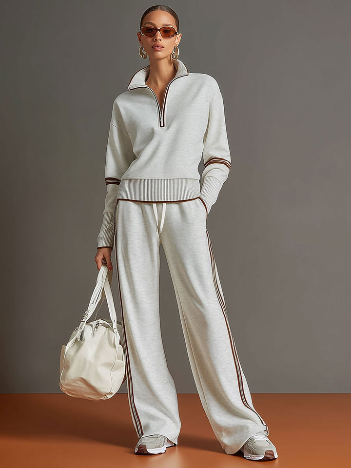Beige damset med stickad tröja och vida byxor i bekväm vardagsstil