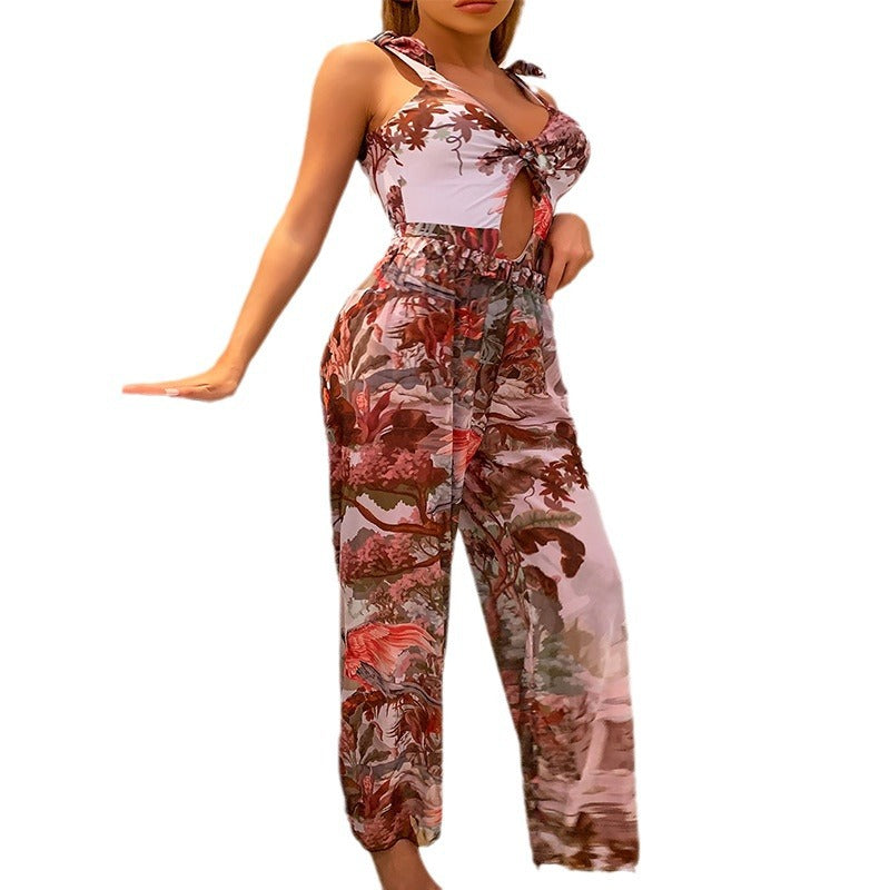 Mode damkläder: blommig jumpsuit med justerbar snörning, en chic och modern stil för kvinnor.