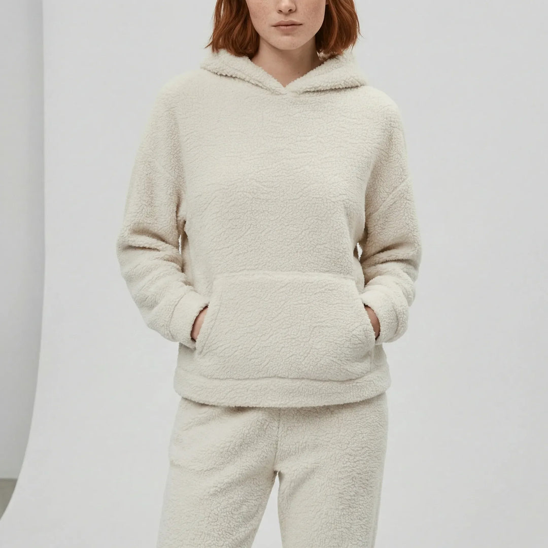 Modernt dam loungewear-set med huva, känguruficka. Avslappnat för bekväm vardag.