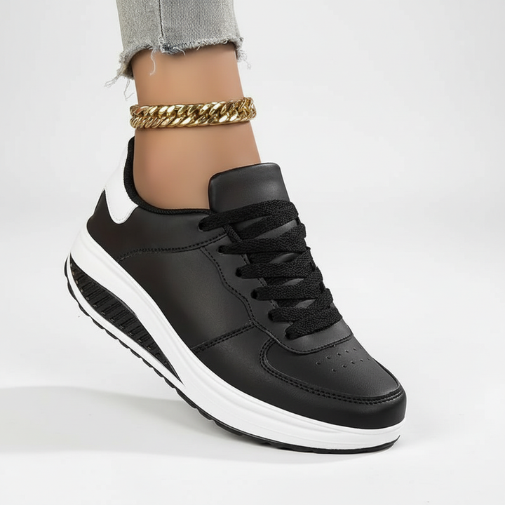 Fashionabla ortopediska sneakers med flexibel sula och andningsbart material för en bekväm passform, sidovy.