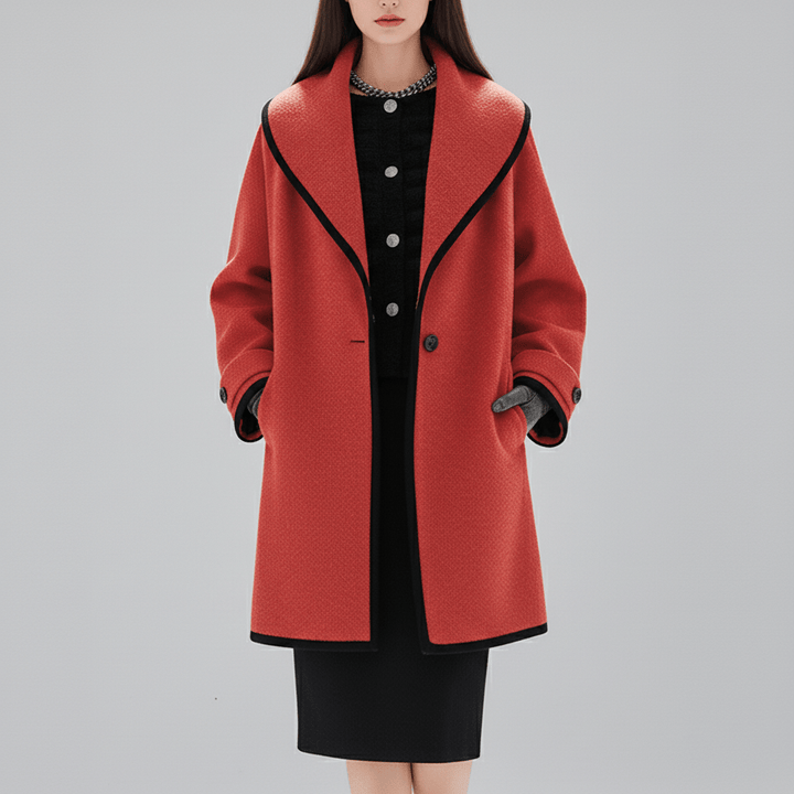 Damkappa Lillian, oversized med huva, perfekt för en avslappnad men sofistikerad look.