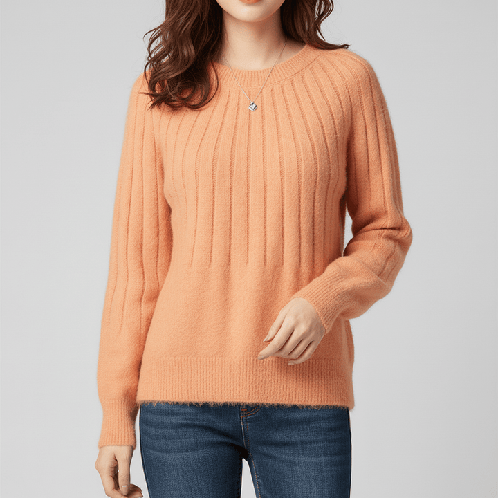 Långärmad damtröja med ribbdetaljer, mjuk och bekväm för en elegant och tidlös look.