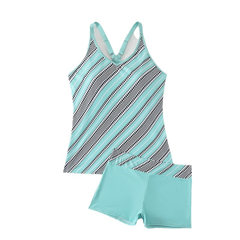 Komplett tankini-set för dam, med sportig design och korsade band, för sommar och sol.