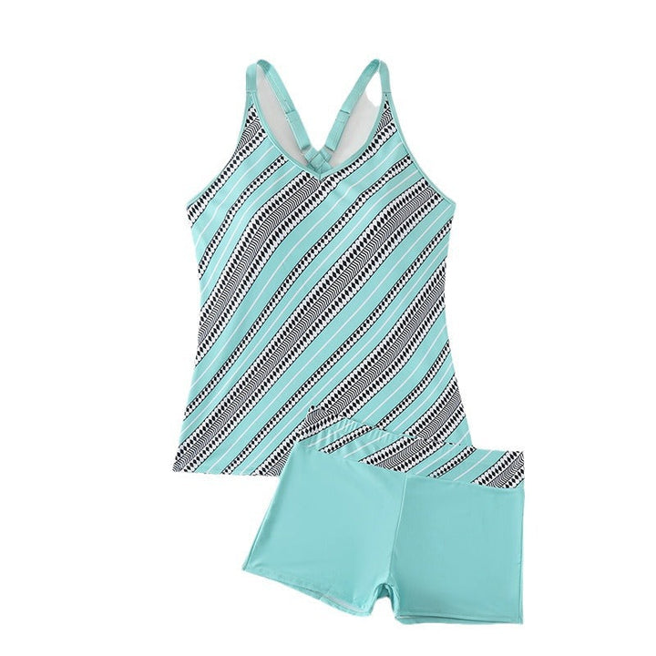 Komplett tankini-set för dam, med sportig design och korsade band, för sommar och sol.