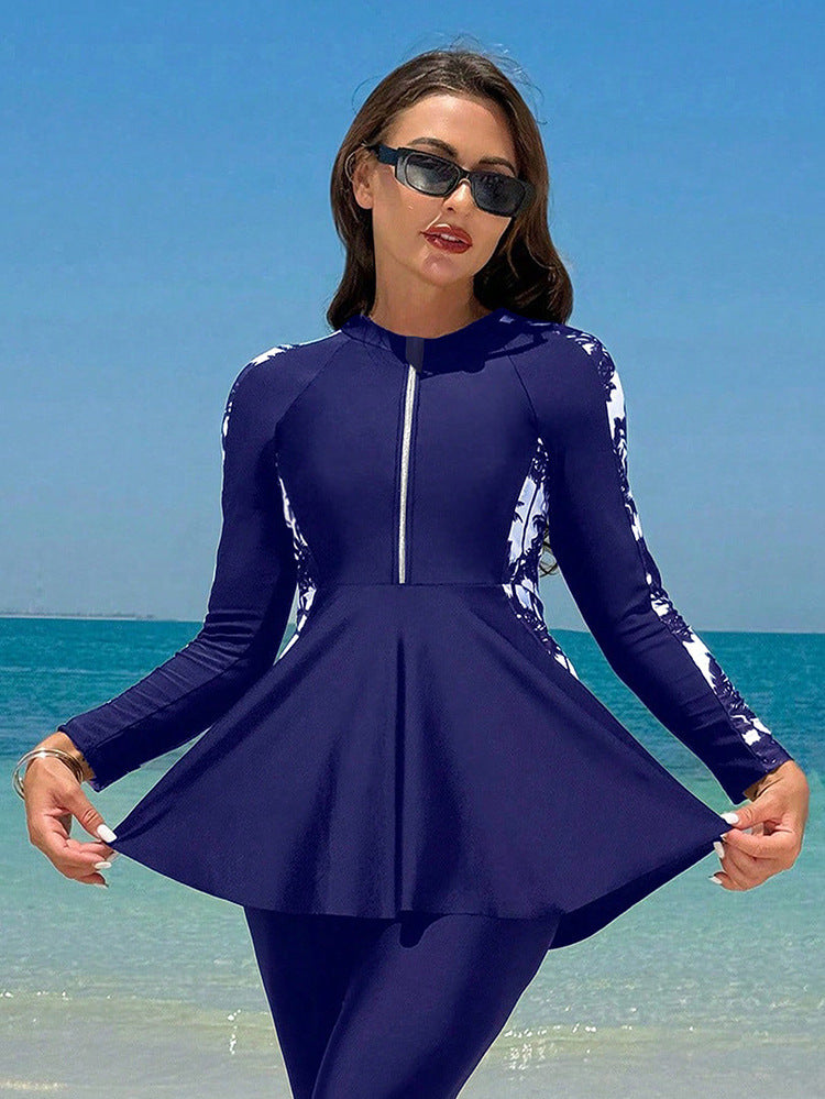 UV-skyddande surfdräkt för dam. Långärmad A-linje baddräkt skyddar huden vid strand & pool, aktiv semester.