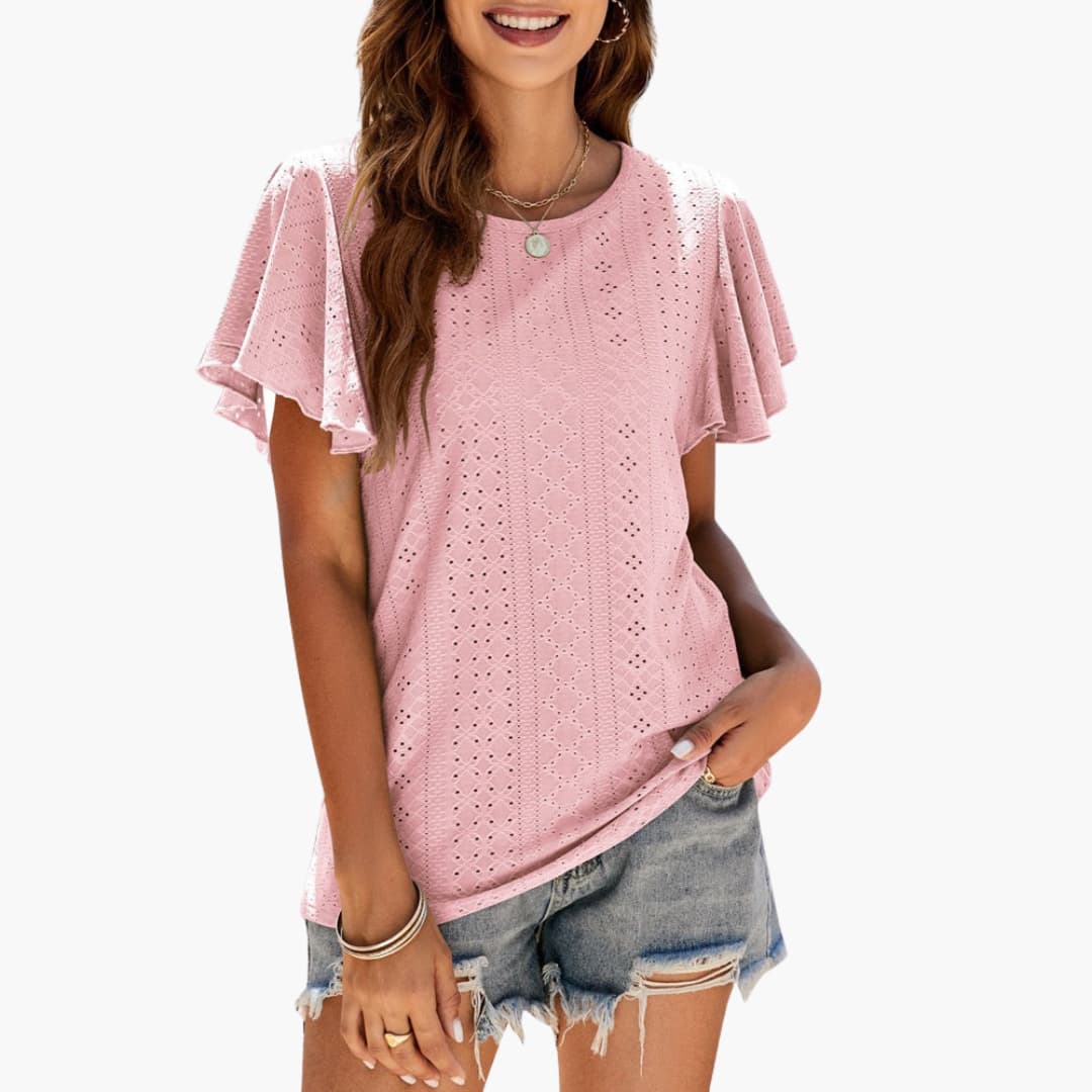 Elegant damtopp med volangärmar och rund hals. Perfekt sommartopp för casual eller dressad look.