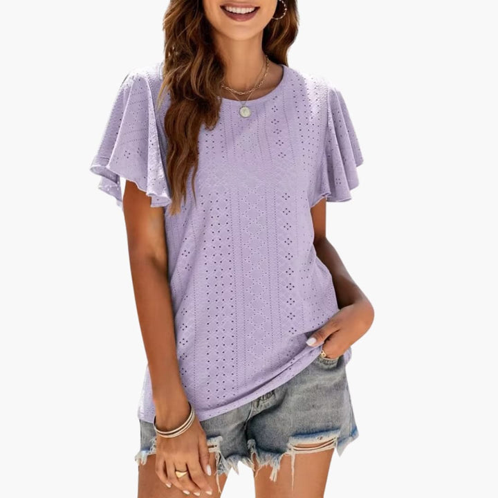 Snygg sommartopp med rund hals och eleganta volangärmar. Denna modetröja passar kvinnor sommar.
