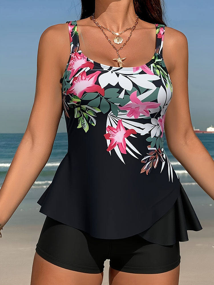 Mönstrad dam tankini set med bekväm flödande topp och shorts. Perfekta badkläder för sommar.