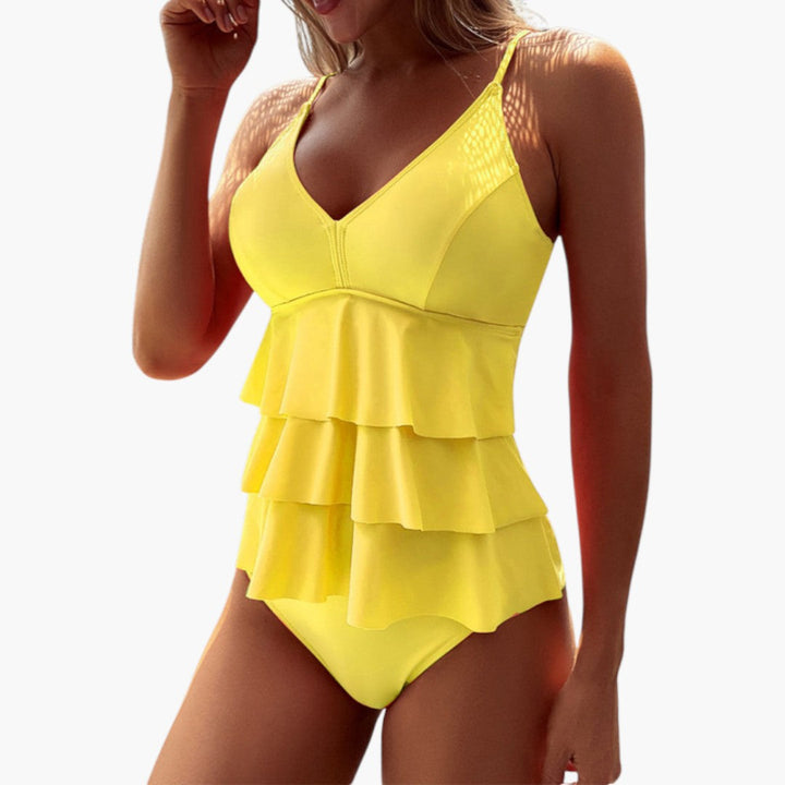 Snygg dam tankini-topp med justerbara axelband för optimal komfort. Idealiskt plagg för bad och simning.