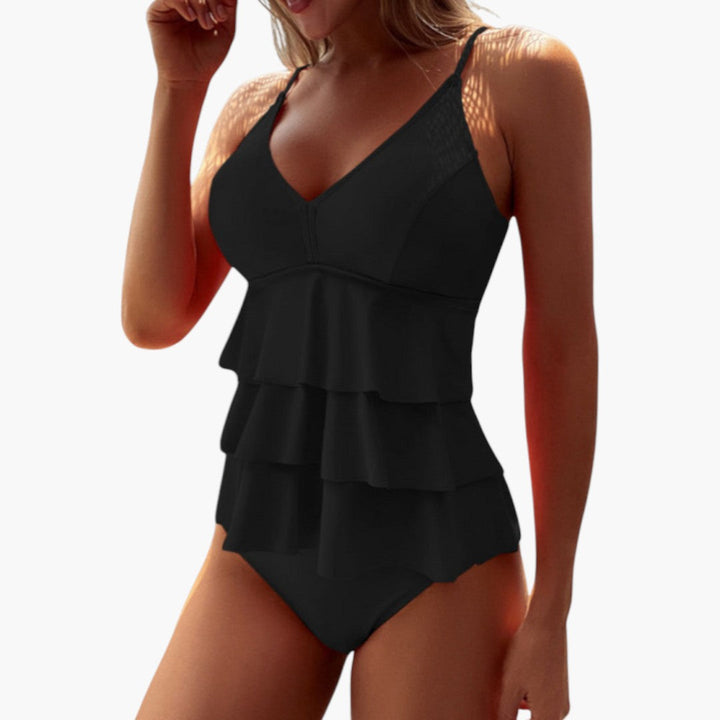Mjuk och stretchig dam tankini i snabbtorkande material, bekväm passform för soliga dagar vid vattnet.