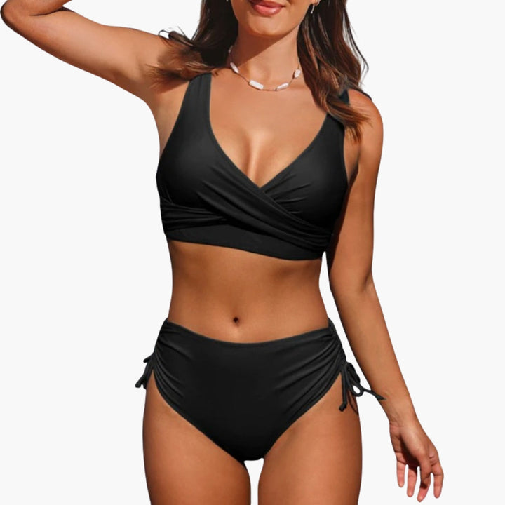 Dam tvådelat bikini-set med justerbar trekantstopp, perfekt för strand och pool. Stilrent enfärgat badmode.