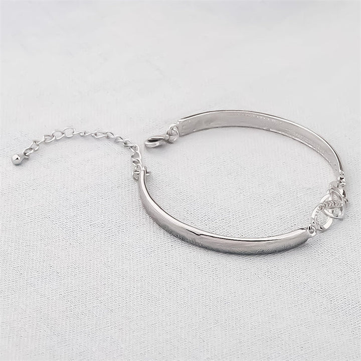 Armband i roseguld och silver med hjärtberlock för dam, elegant design och perfekt present till mamma.