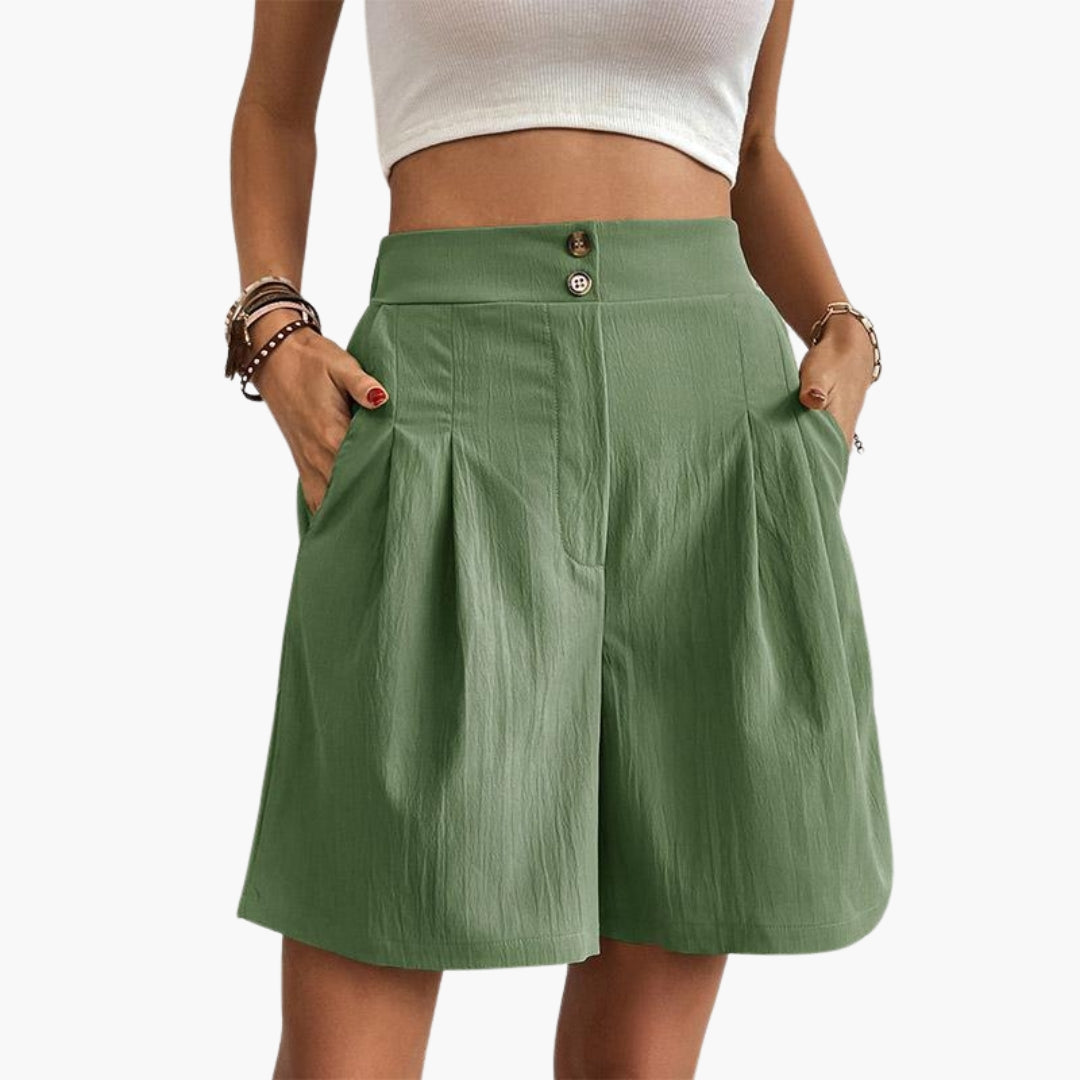 Kvinnobyxor med hög midja och vida ben. Eleganta veckade byxor perfekta för sommaren.