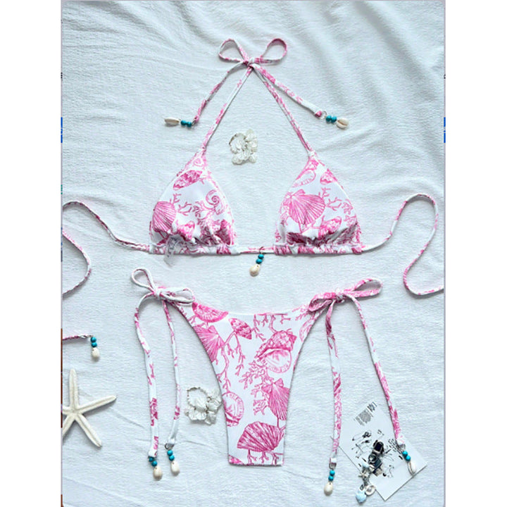 Bekvämt bikini-set för dam med snäckdetaljer och justerbara remmar, idealiskt för stranddagar och bad.