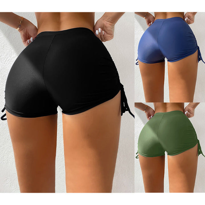 Damer strukturerade badshorts med justerbara sidband, perfekt för strand och simning.
