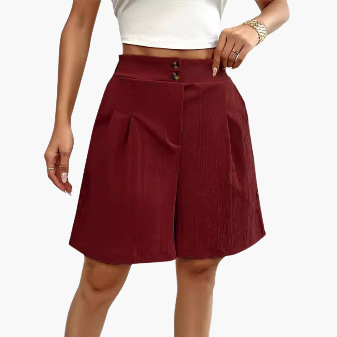 Damshorts med hög midja för komfort och stil. Med dekorativa knappar och sidofickor. Sommarfavorit.