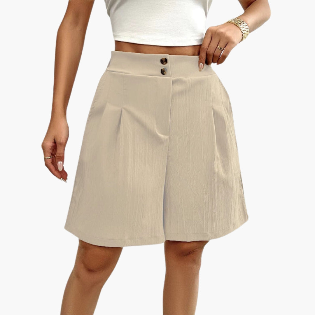 Damshorts med knappar, hög midja och fickor. Trendiga och bekväma sommarshorts för alla tillfällen.
