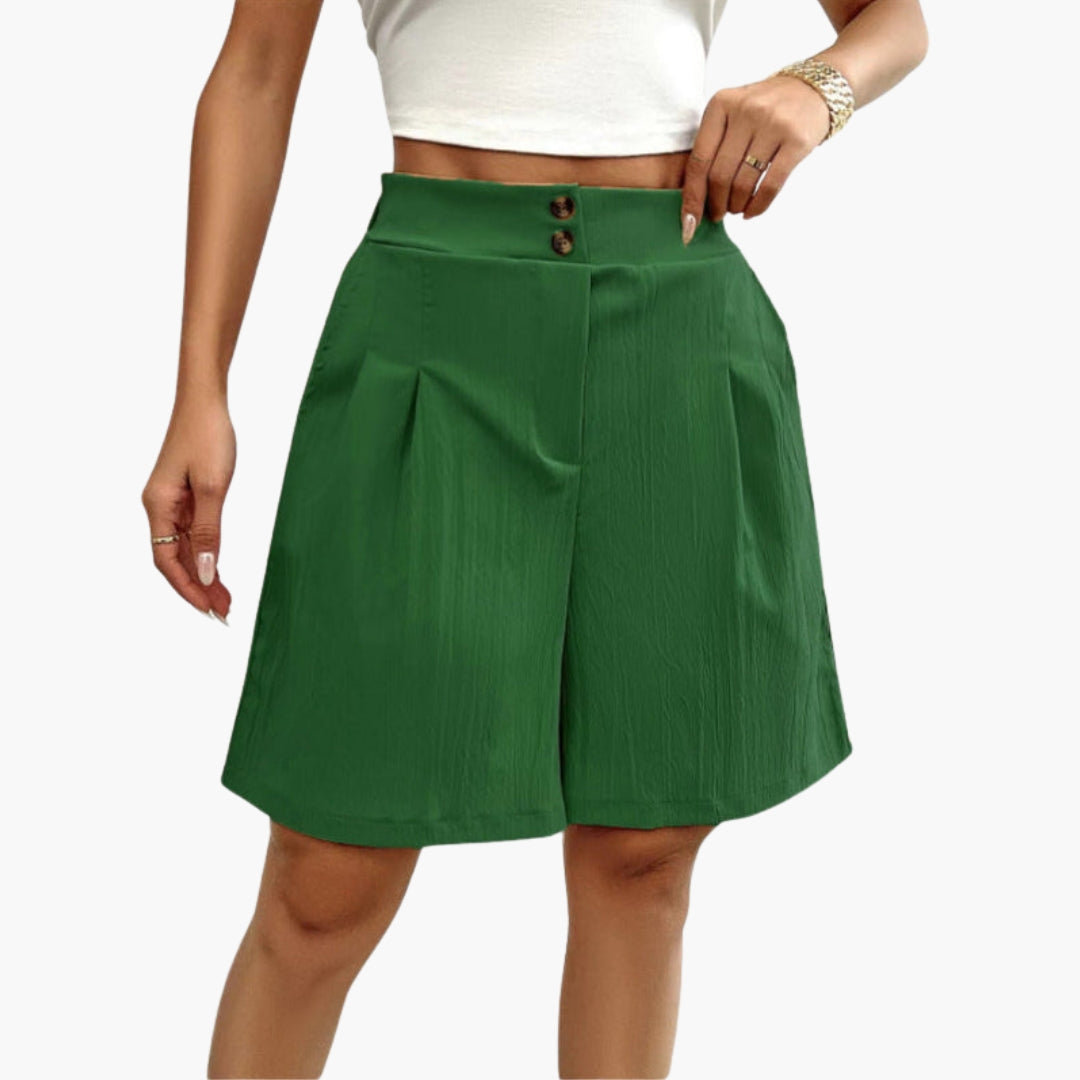 Enfärgad damshorts, hög midja, dekorativa knappar framtill och sidofickor. Sommarplagg för damer.