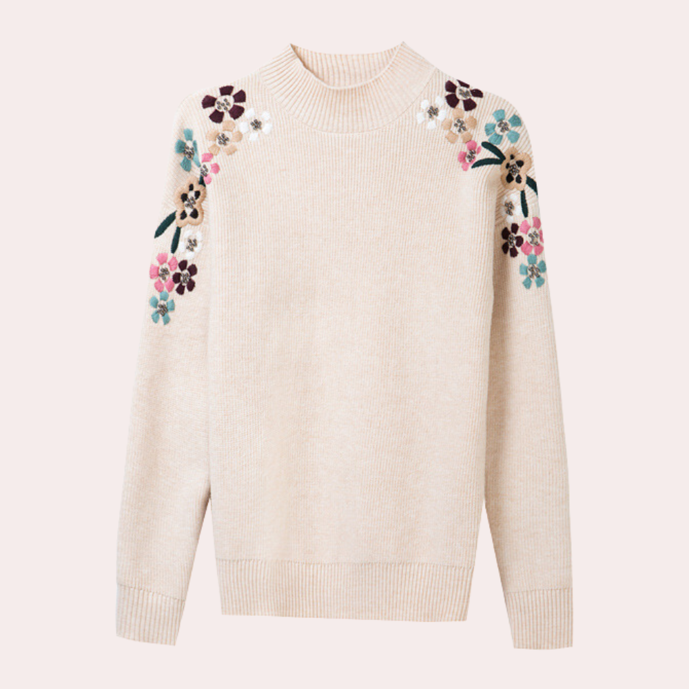 Stickad tröja med lös passform och trendigt blommönster, idealisk för damkläder.