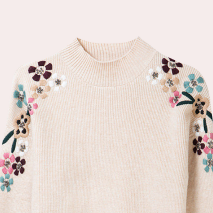 Elegant stickad långärmad tröja med modernt blommönster för dam, rundhalsad.