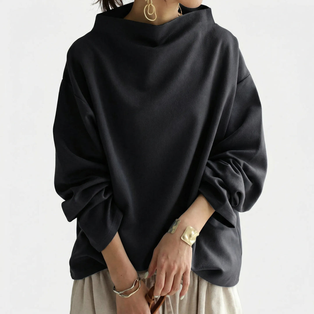 Elegant mörkgrön damtröja med vid passform och unik sjalkrage. Modern pullover för en sofistikerad look.