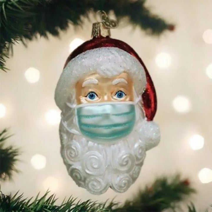 "Detaljerad tomte hängdekoration, färgrik och nostalgisk julprydnad med röd snöre för gran eller hemdekoration."