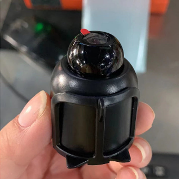 "Diskret svart mini WiFi-kamera för hemövervakning, 1080P HD, elegant design, mörkerseende och rörelsedetektion."