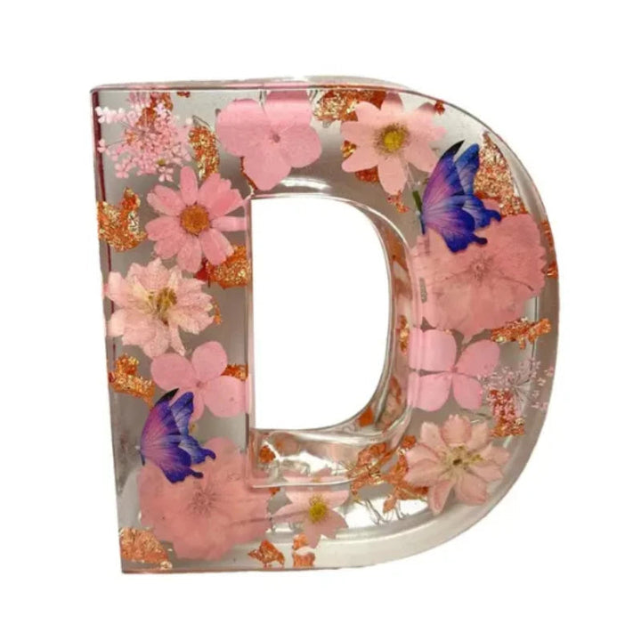 Elegant lampa för sovrummet med äkta blommor i transparent harts