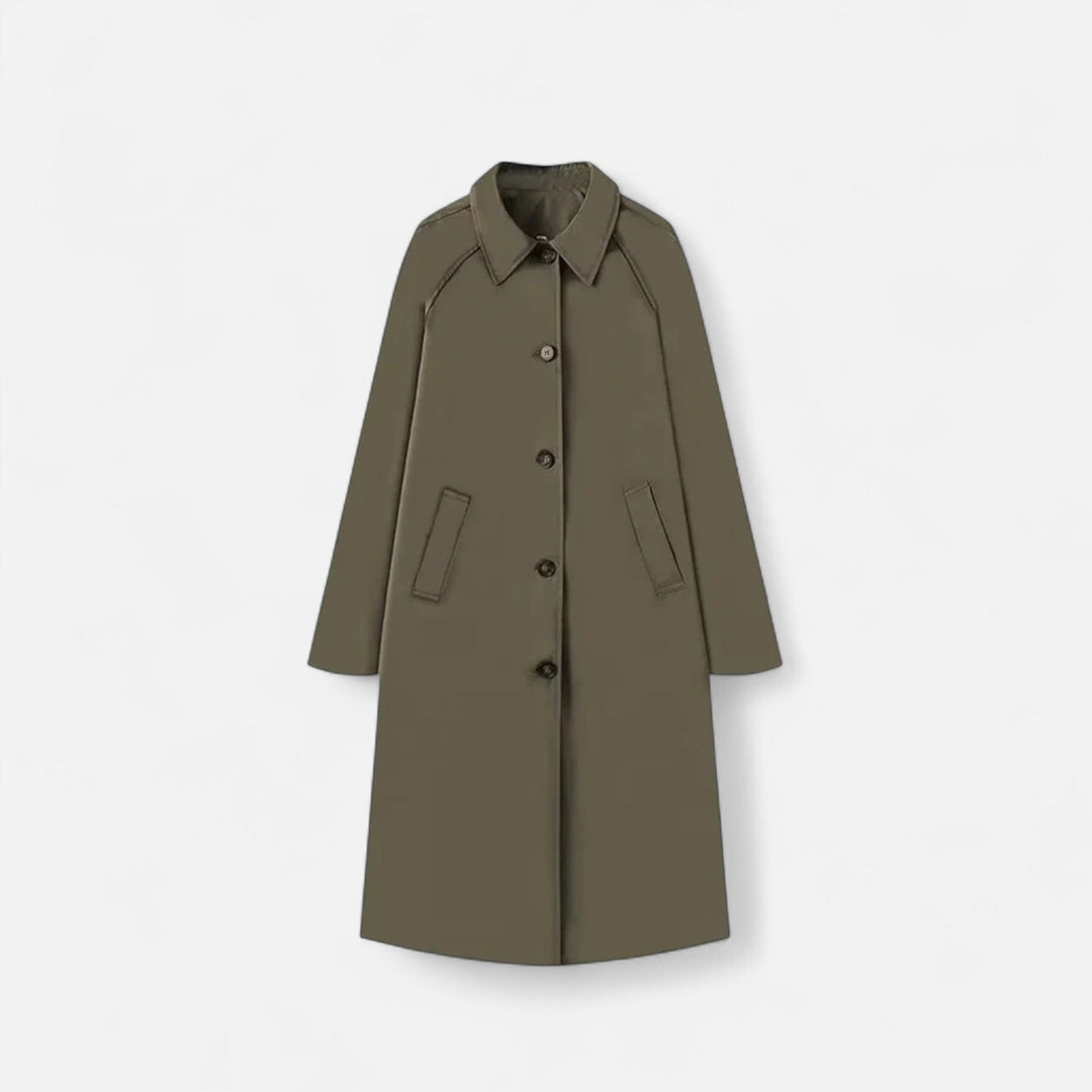 Närbild på tyg och detaljer på retro trench coat för dam mode