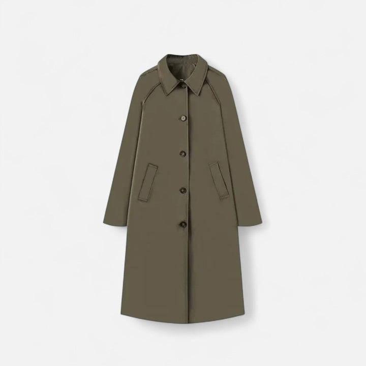 Närbild på tyg och detaljer på retro trench coat för dam mode