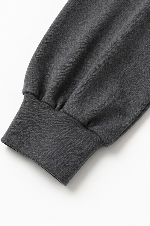 Mysdress för dam bestående av varm tröja med turtleneck och långa vida byxor