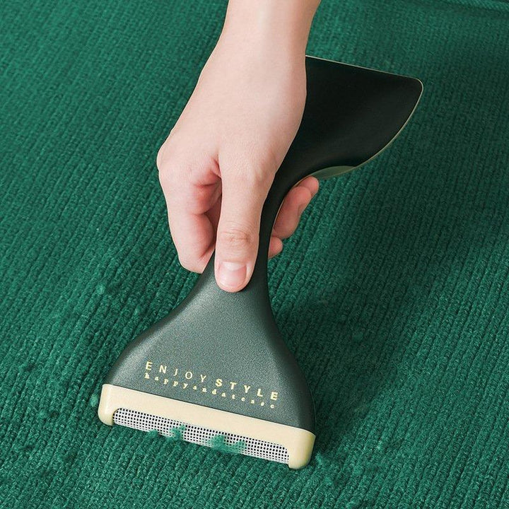 "Dubbelhuvud luddborttagare i grönt visar ergonomisk design och dubbla huvuden för effektiv luddborttagning."