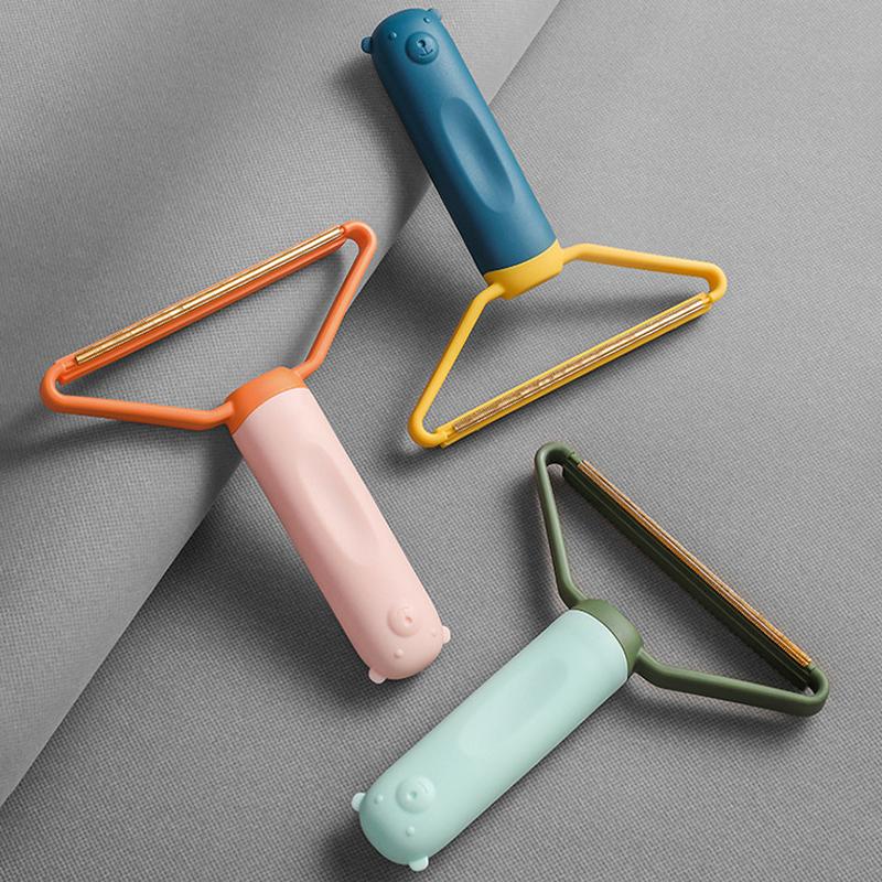 "Dubbelsidig ludd/dammborttagare i grön, rosa, blå, kompakt design för effektiv omvårdnad av tyg utan batteri."