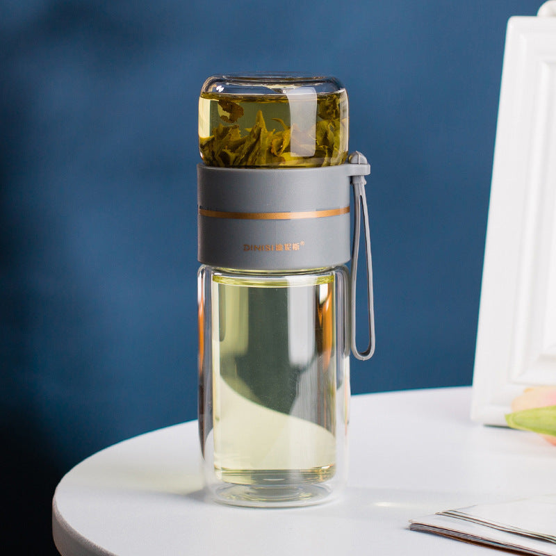 Smart isolerad teflaska med tesil i tåligt borsilikatglas. Njut av perfekt bryggt te på språng.