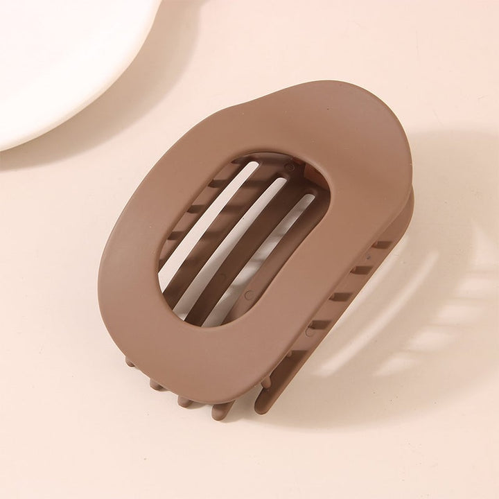 "Elegant akryl hårklypa för alla hårtyper, stilren design i flera färger, hållbar och flexibel accessoar."