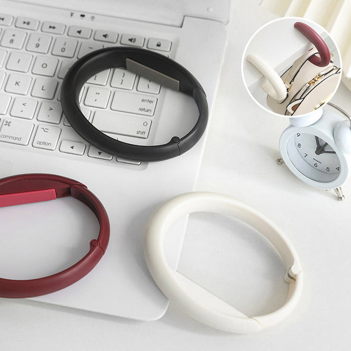 "Elegant bärbar väskkrok för effektiv upphängning, kompakt design, mångsidig användning, perfekt för kaféer."