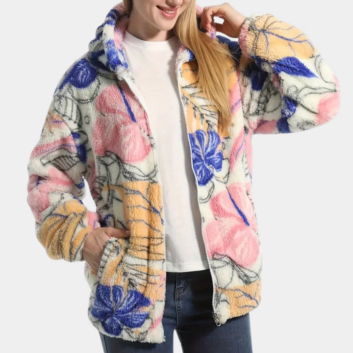 Elegant blommönstrad damvinterjacka Elira med varm fleece och praktisk huva, perfekt för höst & vinter.