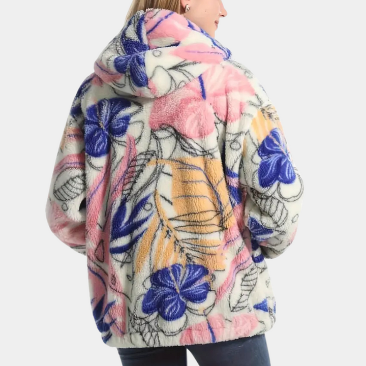 Stilren varm damjacka med elegant blommönster och mysig huva. Idealisk för trendigt kvinnomode under kalla dagar.