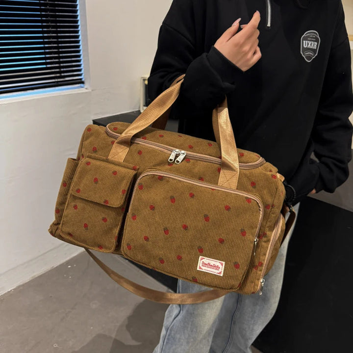 Beige manchester åkpåse 25L för dam med praktiskt skofack, perfekt weekendväska.