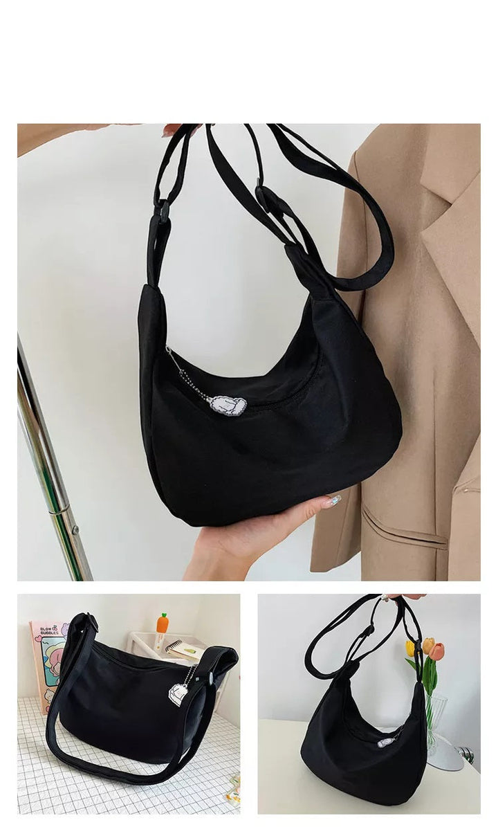 Praktisk och elegant handväska för dam, bärbar som axelväska eller modern crossbodyväska.
