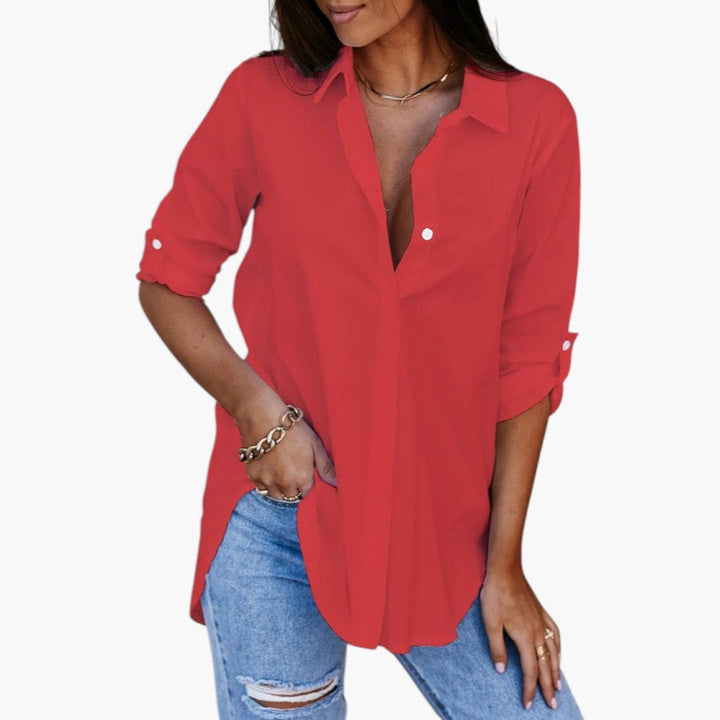 Elegant dam blus med skjortkrage och hel knäppning fram. Långärmad, perfekt för kontor och vardag.