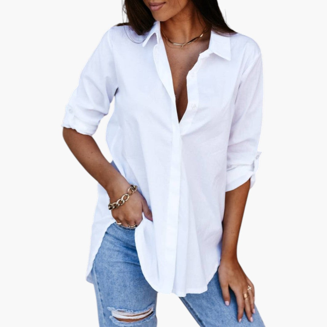 Mångsidig dam blus med knäppning fram, skjortkrage. Långärmad design för en elegant kontorslook.